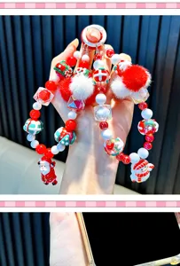 Handheld Christmas beaded phone strap featuring Santa and Snowman charms with red pom-poms