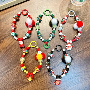 Set of five festive Christmas beaded phone straps featuring Santa, Snowman, and wreath charms