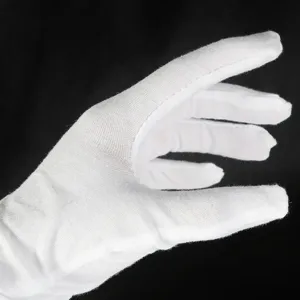 Close-up detail of breathable white cotton work gloves for delicate anti-oxidation tasks
