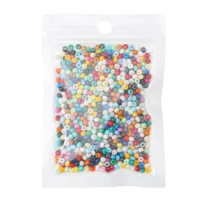 Detailed macro shot of various colorful glass seed beads packed in a transparent pouch