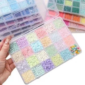 Detailed view of 28-grid organizer box filled with pastel seed and tube beads for DIY jewelry