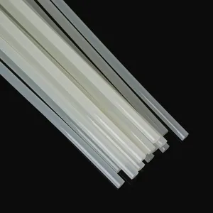 Detailed macro shot of transparent hot melt glue sticks for DIY crafting on dark background