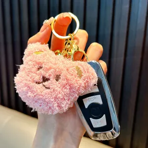 Cute pink plush bear keychain with soft curly fleece and gold metal ring for bags
