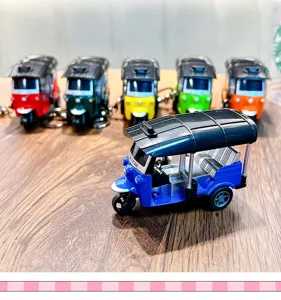 Mini pull-back tuk-tuk rickshaw model keychain in vibrant blue and assorted colors