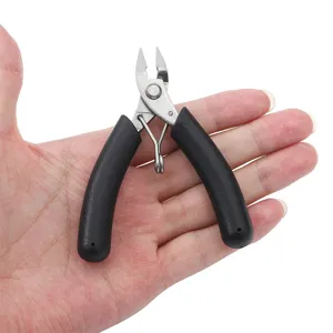 Close-up of mini stainless steel jewelry diagonal cutters held in a palm for scale
