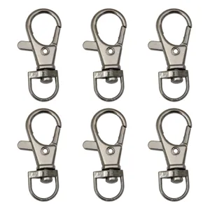 Macro view of six gunmetal alloy lobster claw clasps for DIY jewelry projects.