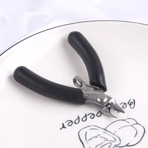 Close-up of mini stainless steel diagonal pliers with black ergonomic anti-slip handles