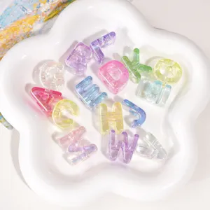 Macro view of iridescent colorful acrylic alphabet beads for DIY jewelry making
