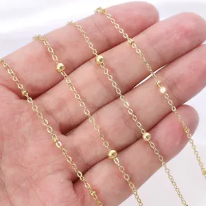 Detail macro view of 18K gold plated beaded chain for DIY handmade jewelry making