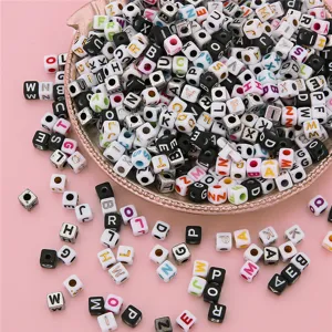 Macro detail of colorful square acrylic alphabet beads for DIY jewelry making crafts