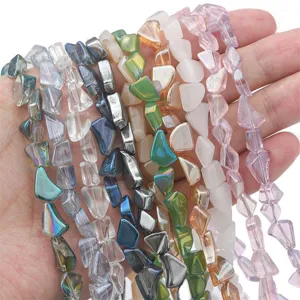Macro view of various colored irregular glass beads for DIY jewelry making projects