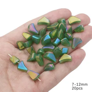 Close-up of irregular iridescent green glass beads for handmade jewelry making 7-12mm
