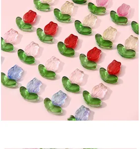 Detailed view of colorful gradient glass tulip beads for DIY jewelry making.
