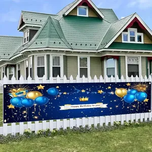 Blue and gold birthday banner decoration with balloons and crown for outdoor party