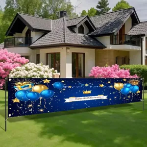 Blue and gold birthday party banner featuring balloons and crown decoration for garden.