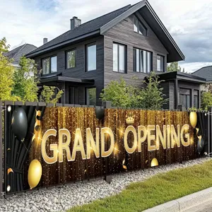 Large black and gold Grand Opening banner with glitter balloons and crown design motif