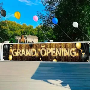 Large black and gold grand opening banner with glitter balloons and crown design for shops