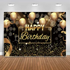 Sfondo fotografico di compleanno nero e oro con palloncini dorati e stelle decorativi