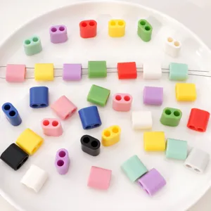 Detail macro shot of various colorful 15mm double-hole ABS plastic drawstring buckles