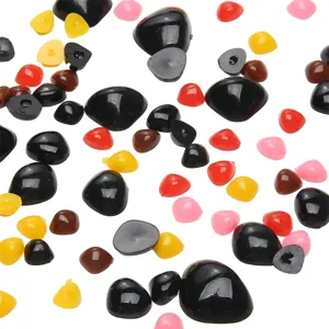 Detailed close-up of colorful acrylic triangle noses for DIY plush toy crafting