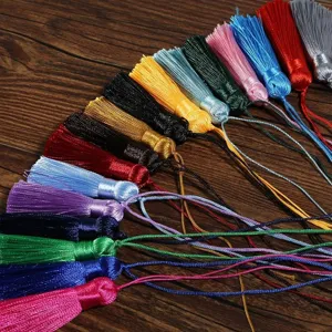 Detail view of colorful handmade DIY silk tassels for bookmarks and fan pendants