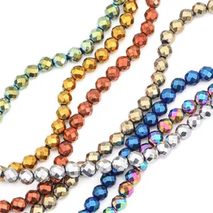 Macro detail showing faceted electroplated hematite beads in various metallic finishes