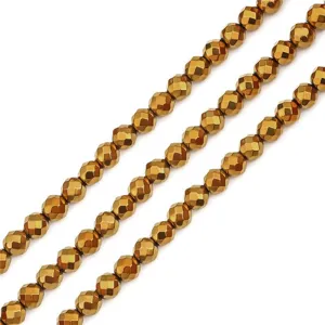 Close-up detail of faceted golden hematite round beads for DIY jewelry handmade accessories