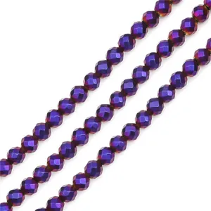 Macro detail of faceted round beads with iridescent purple electroplated finish for DIY crafts
