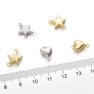 Close-up detail of gold and silver star and heart shaped magnetic jewelry clasps