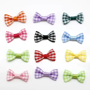 Detail view of colorful gingham ribbon bows for DIY hair accessories and crafting.