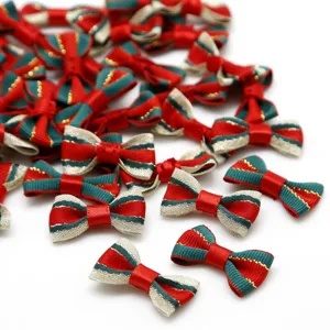 Detailed scattered view of red and green striped ribbon bows for DIY hair accessories