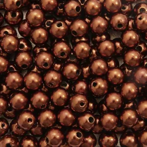 Macro view of bronze ABS acrylic round pearl beads for DIY jewelry making