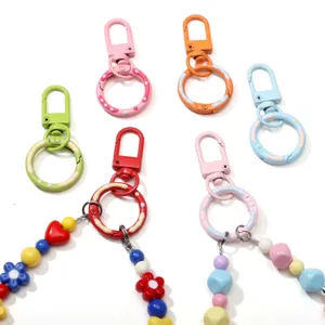 Close-up view of colorful alloy donut spring clasps for DIY keychain and bag charm crafts