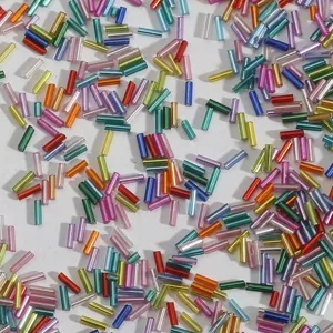 Close-up of colorful silver-lined glass bugle beads for DIY jewelry and embroidery