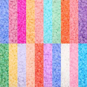 Close-up detail of various multi-colored matte seed beads for DIY jewelry making crafts