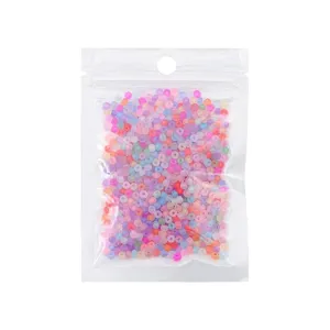 Pack of multi-colored frosted seed beads in a transparent plastic self-sealing bag
