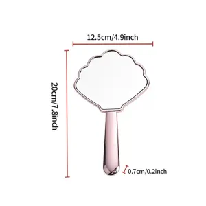 Detaillierte Größenübersicht für den muschelförmigen Handspiegel in Roségold-Optik.