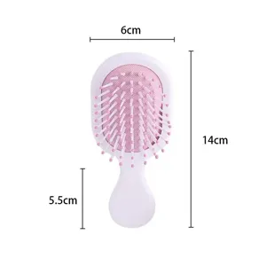 Mini portable pink airbag hairbrush for children with 14cm x 6cm size dimensions