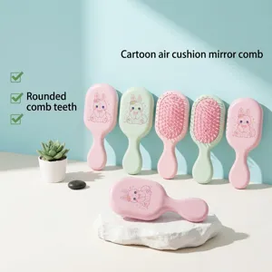 Detail of cute pink cartoon bunny air cushion hairbrush with massage bristles.