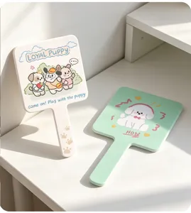 Deux jolis miroirs à main carrés blanc et vert menthe avec motifs de petits chiots.