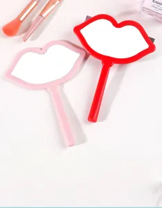 Creative lip-shaped portable hand makeup mirror with handle in red and pink colors
