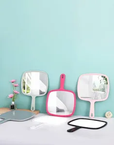 Variety of large handheld vanity mirrors with hanging handles in six vibrant fashion colors.
