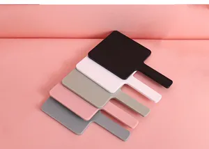 Detailed view showing five different colors of portable square handheld plastic vanity mirrors