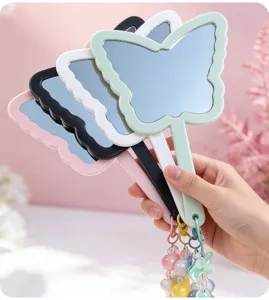 Detail shot of cute butterfly-shaped handheld mirrors with colorful beaded charms