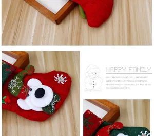 Close-up of festive red and green felt Christmas mini stockings with snowman decor