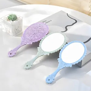 Vintage handheld makeup mirror with embossed plastic handle in pastel colors set