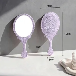 Vintage lavender handheld makeup mirror with intricate floral patterns and clear dimensions.