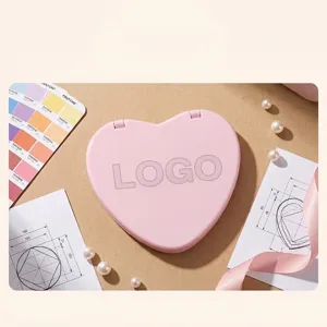 Premium pink heart-shaped compact mirror featuring a portable double-sided design