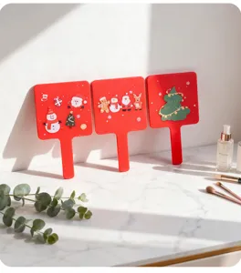 Festive red handheld square makeup mirrors with 3D Christmas characters on marble