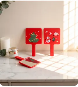 Detailed view of Christmas themed red handheld square makeup mirrors